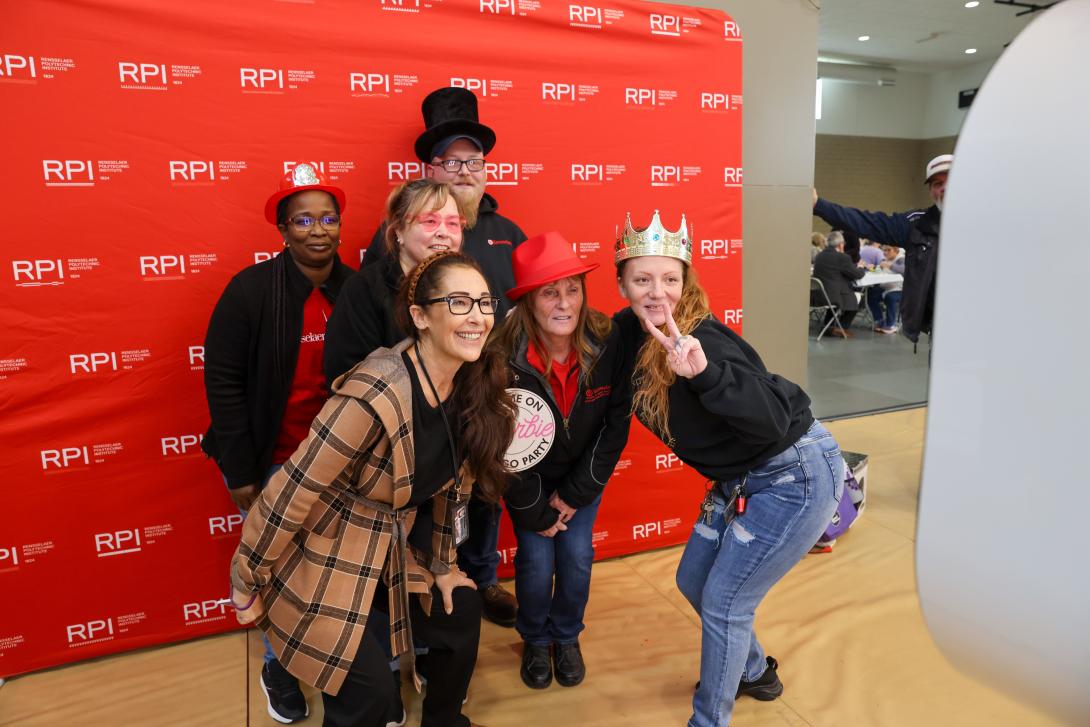 Picture of 6 people posing for a photobooth picture